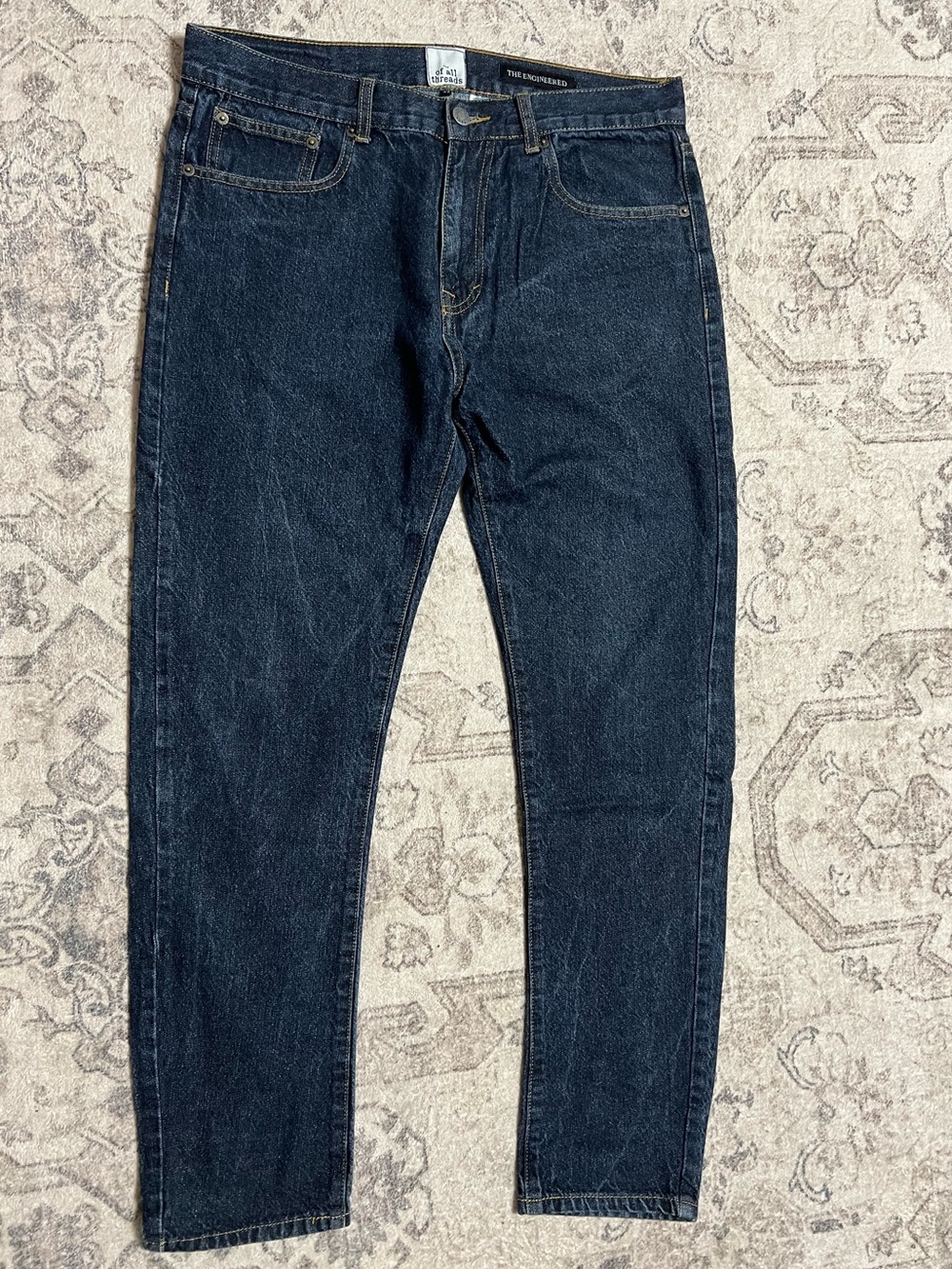Of All Threads "The Engineered" slim-fit jeans—dark denim wash